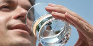 cup of water being sipped