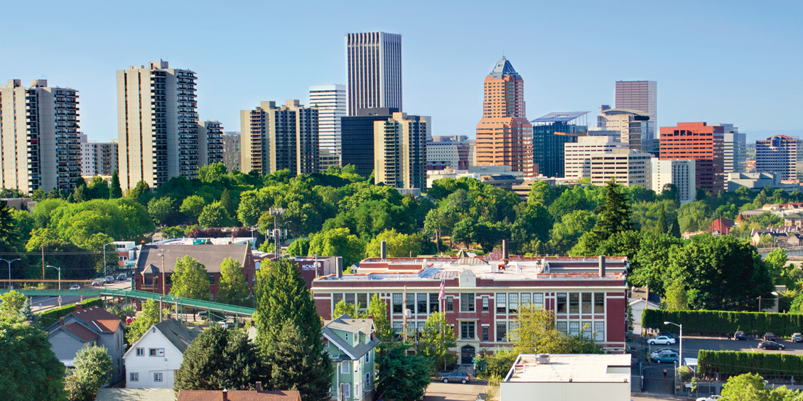 Photo of NUNM’s urban campus located in southwest Portland, just a short distance from downtown and the Willamette River, with a clear view of the Portland Aerial Tram connecting the city’s South Waterfront district and the main Oregon Health & Science University campus.