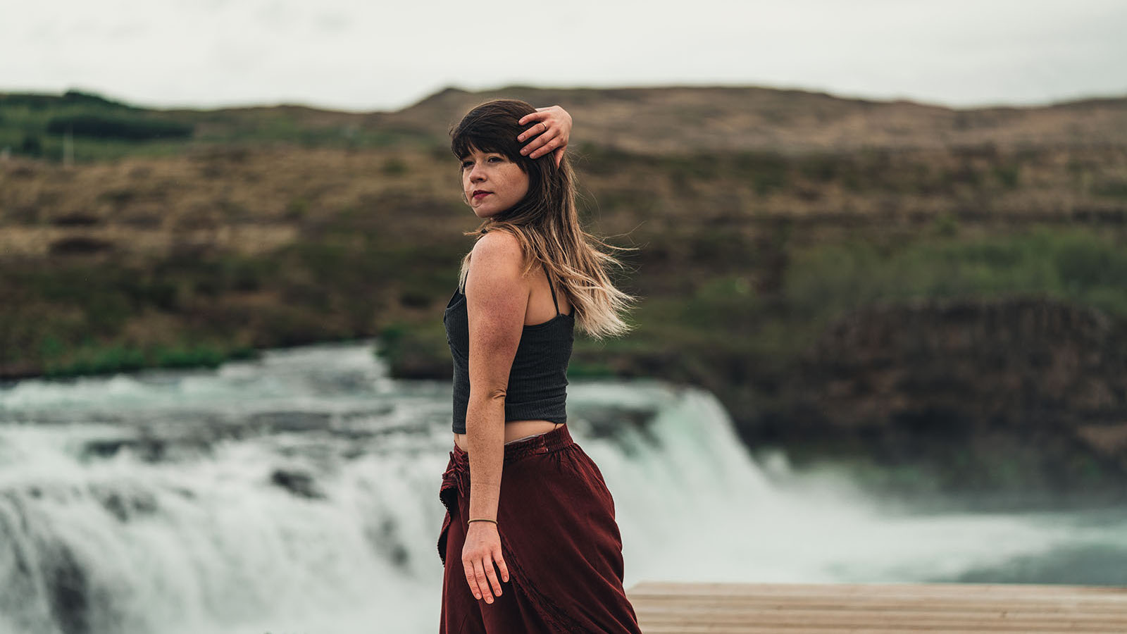 Miquella Young dancing near waterfall