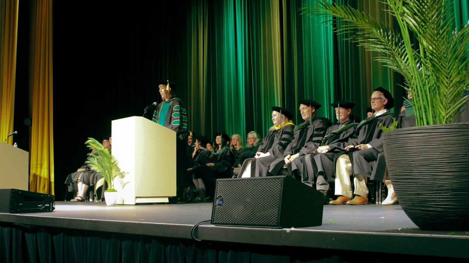 NUNM 2025 graduation speakers on stage
