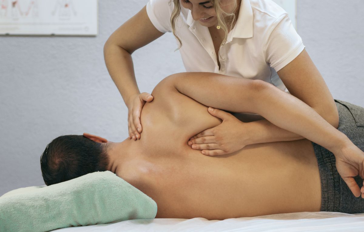 NUNM massage therapy student providing care to a patient in the teaching clinic