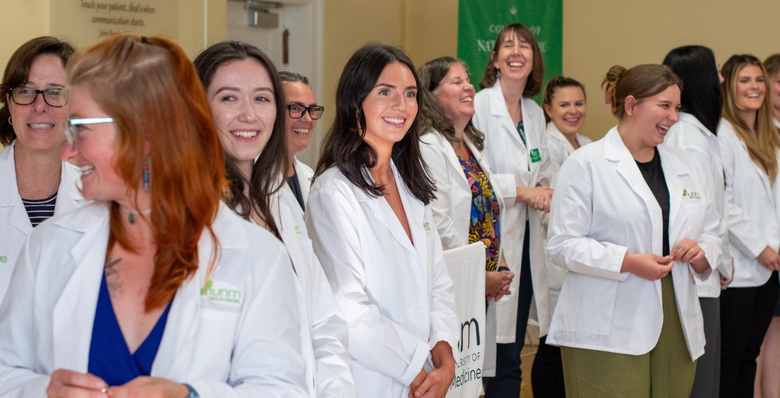 NUNM students receiving their white coats at the white coat ceremony