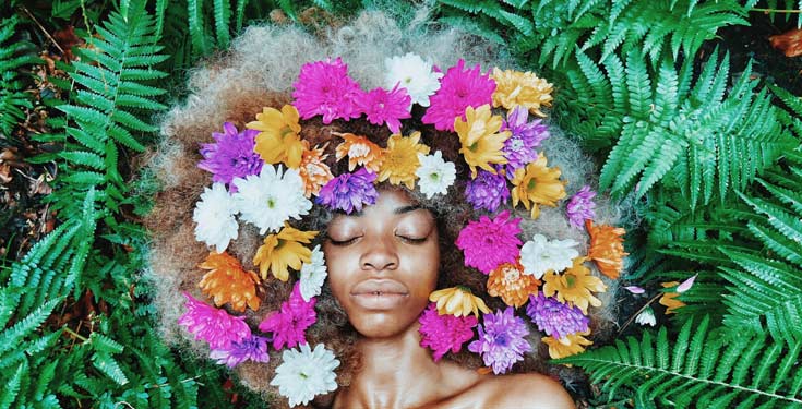 black woman with flowers in her hair