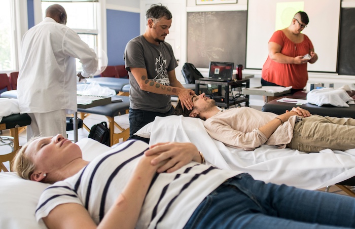 NUNM students learn massage therapy and integrative therapeutics techniques.